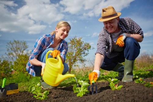 First aid kit and emergency equipment on site during garden maintenance